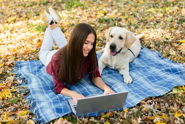 Smiley woman with a cute labrador